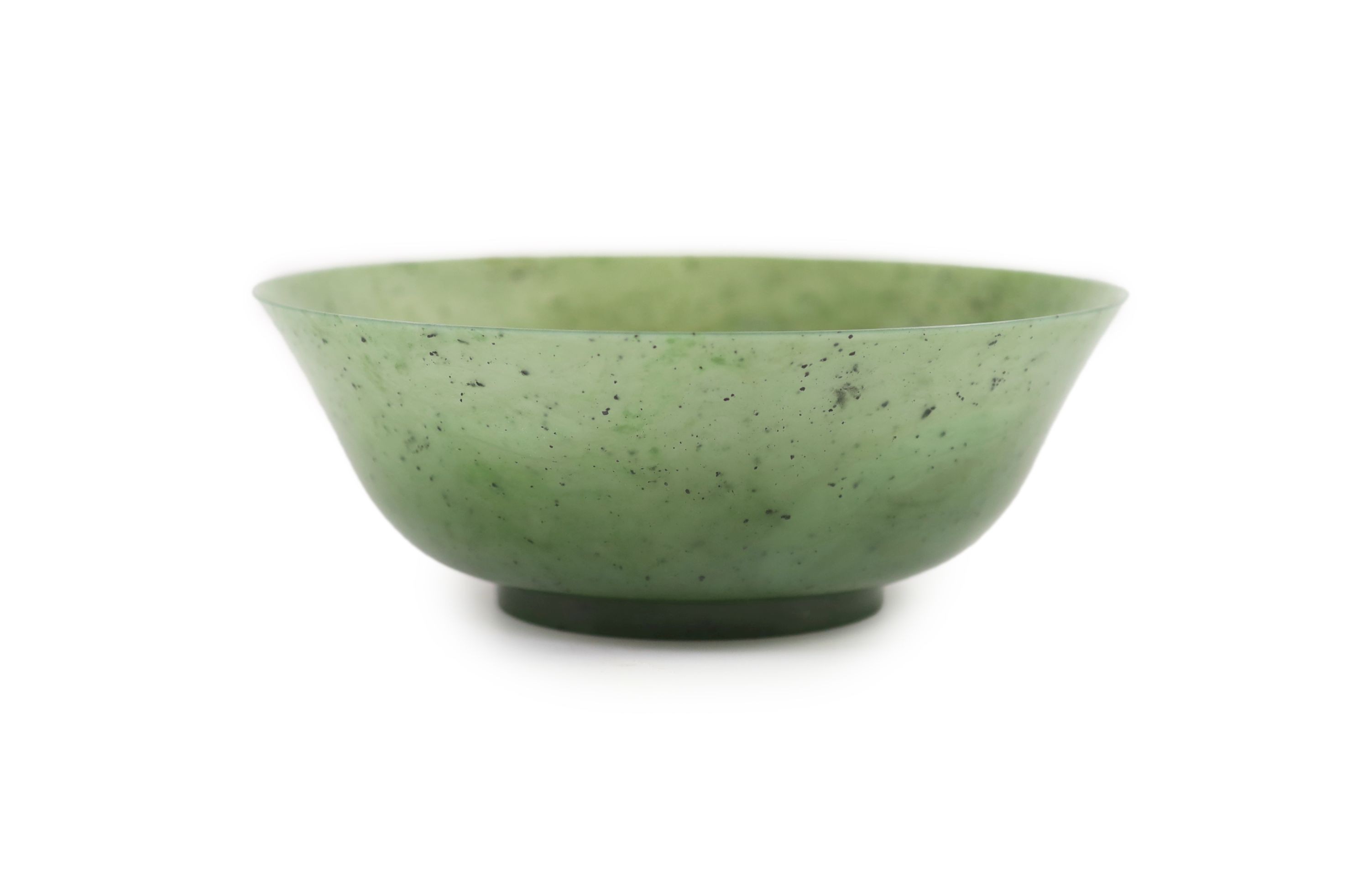 A Chinese spinach green jade bowl, 19th century 22 cm diameter